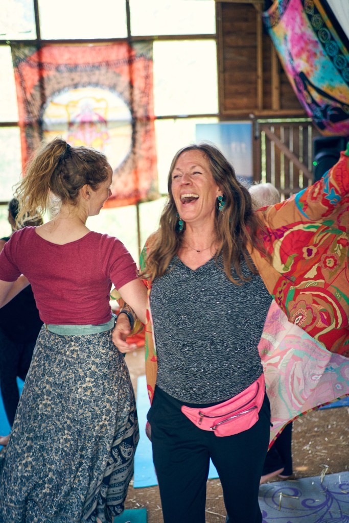 Cat Googe dancing with a workshop attendee at Om & Bass festival